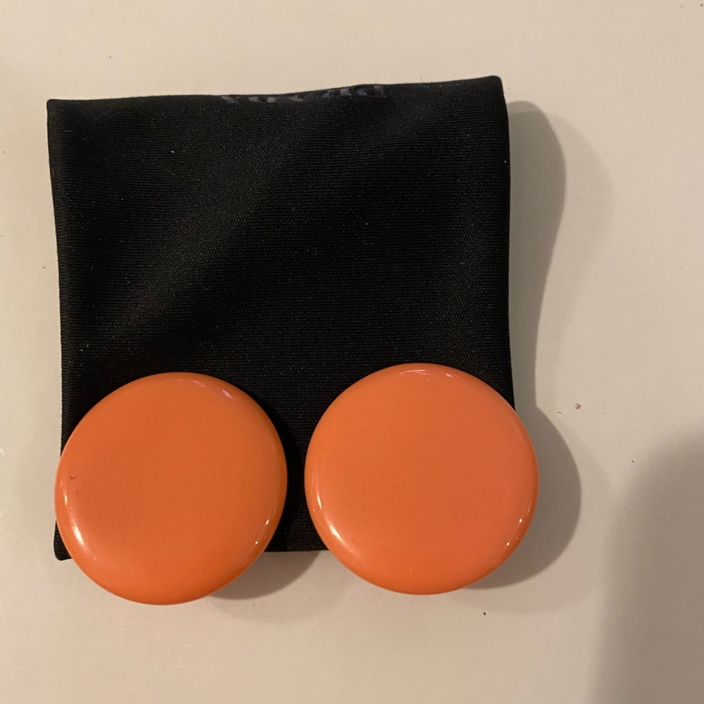 Orange circle clip on earrings